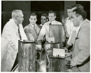 Dr. A. T. Hertig, Dept. of Pathology, HMS, using specimens to teach medical students.