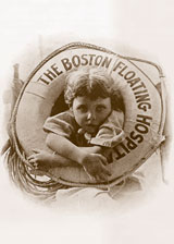 Old photograph of a child leaning through a Boston Floating Hospital life preserver