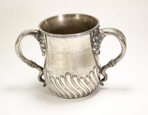 Photograph of a stemless sliver loving cup with the engravings "Oliver Wendell Holmes" and "The Pledge of Friendship"
