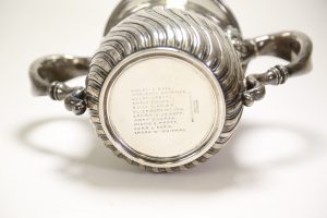 Photograph of the bottom of the cup showing the eleven names engraved there: Helen C. Bell, Marianne Brimmer, Susan Cabot, Annie Fields, Alice G. Howe, Elizabeth Howes, Sarah O. Jewett, Mary G. Lodge, Minnie C. Pratt, Cora L. Shaw, and Sarah W. Whitman
